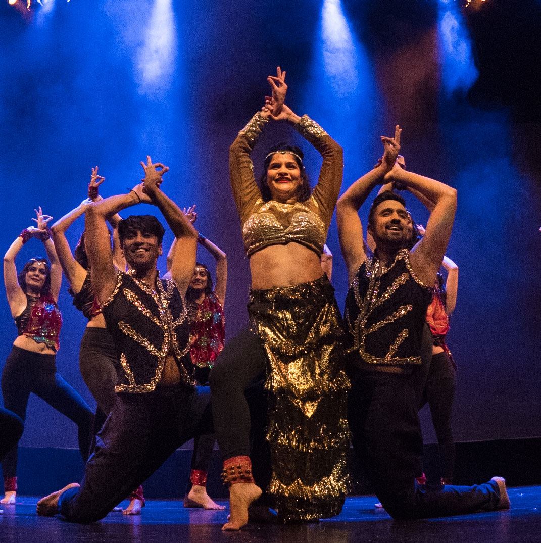 Dance artists from Shiamak's Bollywood Jazz pose mid performance