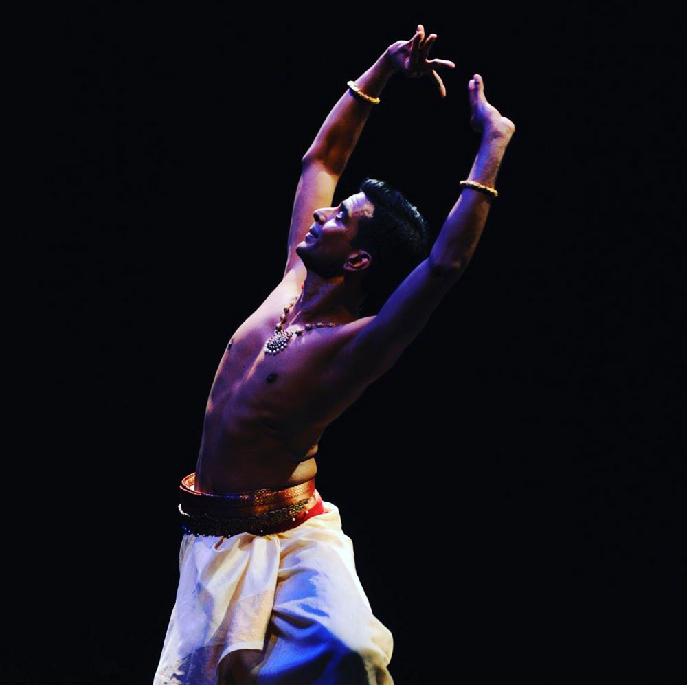 Dance artist Sujit Vaidya poses mid performance