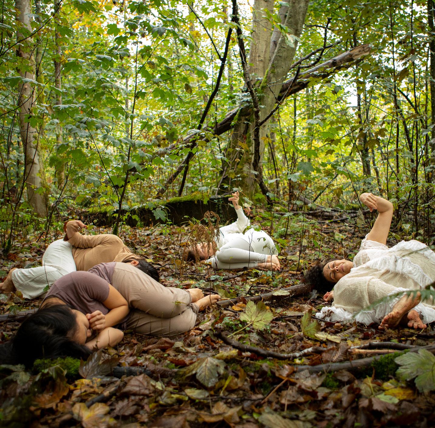 dance artists from Raven Spirit Dance Society perform in a forest