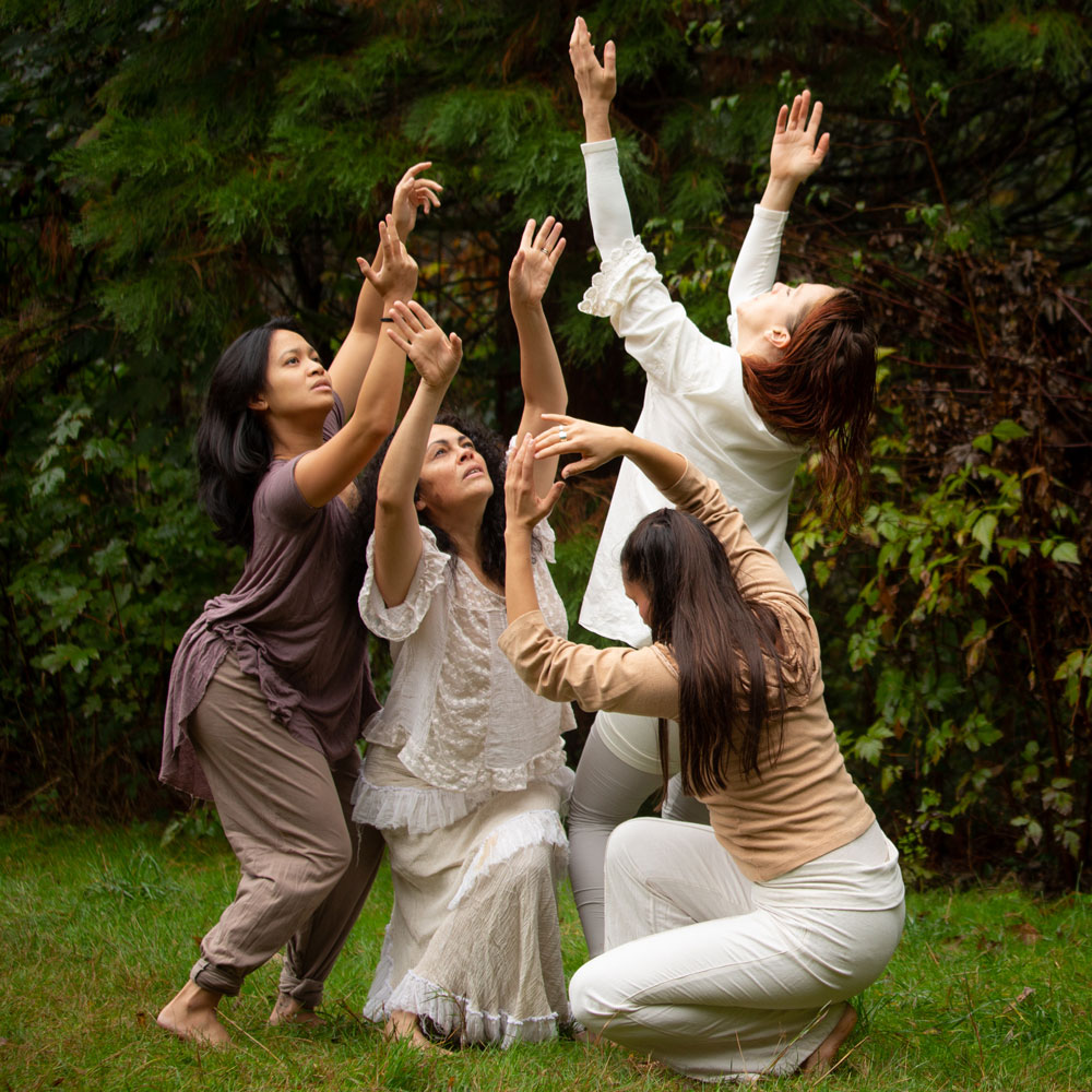 Dance artists from Raven Spirit Dance Society perform outside