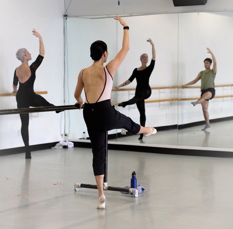 Dancers pose during Linda Arkelian's dance class